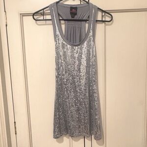 Bebe 2b Silver Sequined tank top with t back.  Very flattering. Great condition.